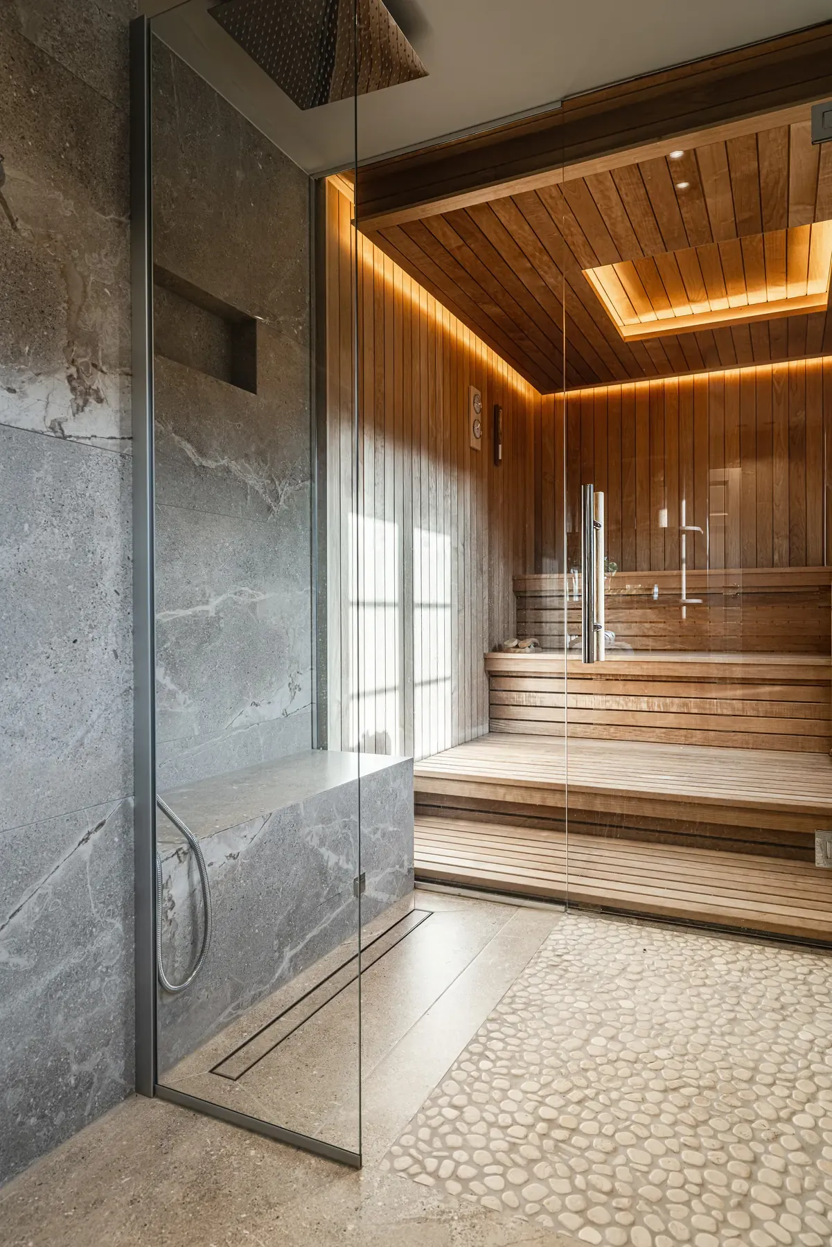 Shower with a glass wall into the sauna