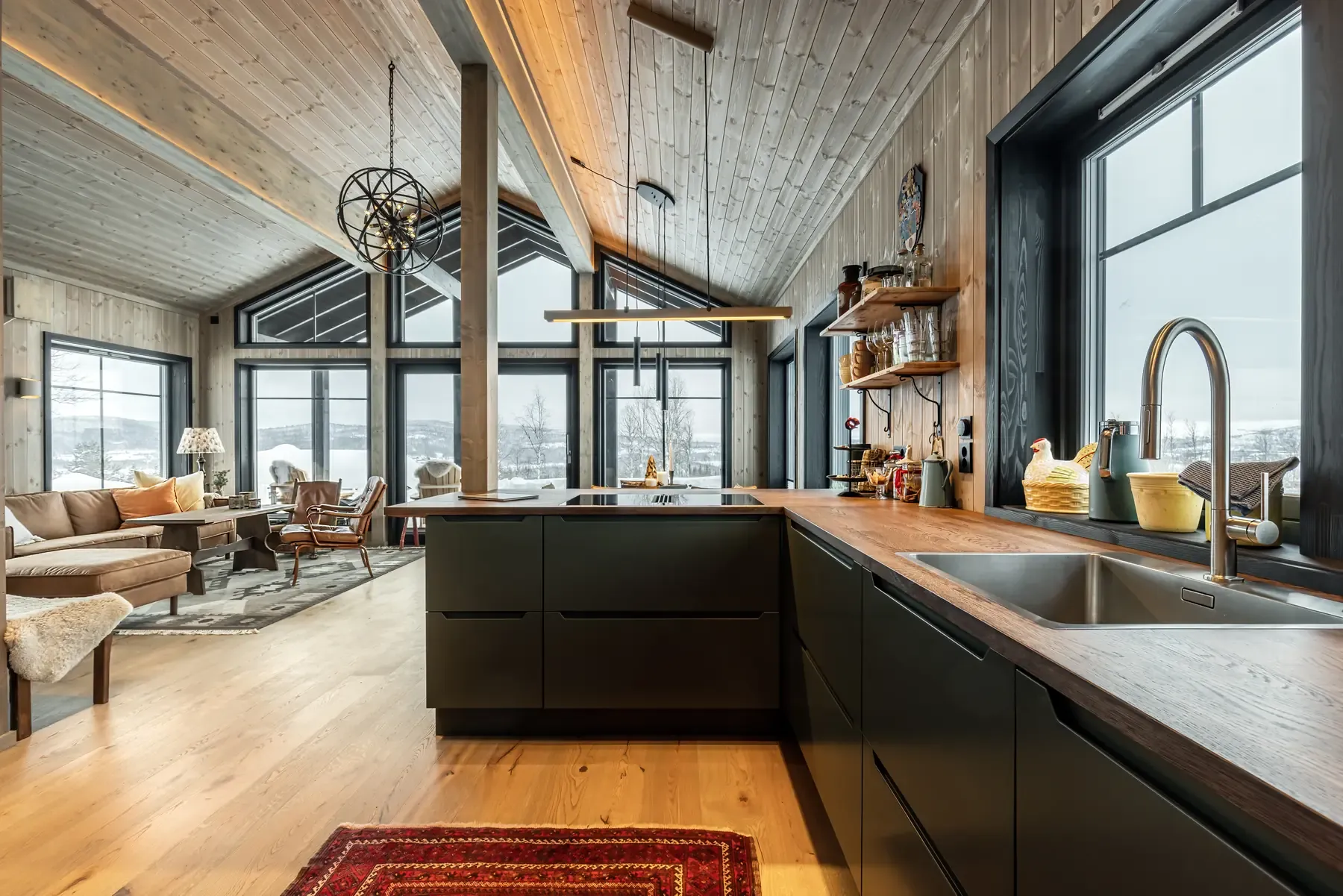 Kitchen with dark fronts and a view