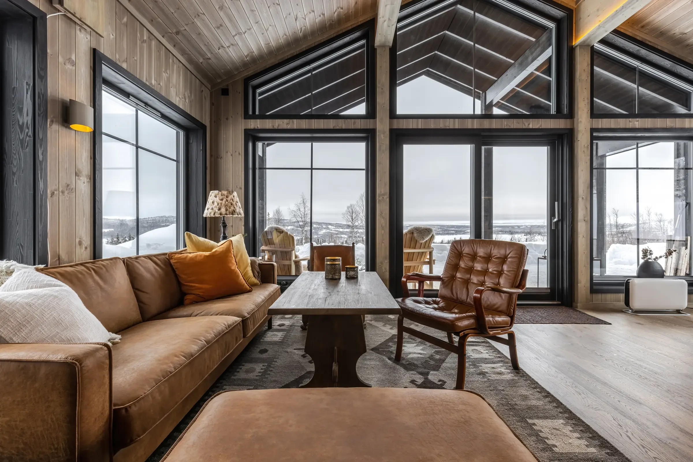 Living room in the extension with large windows facing the view